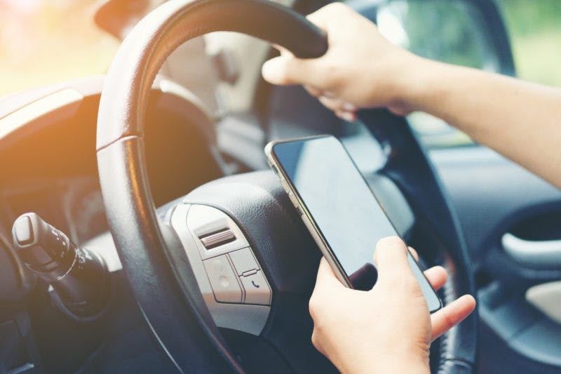 Government to make it illegal to use a hand-held mobile phone while driving ‘under any circumstance’